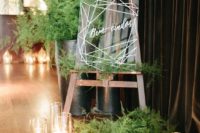 22 fern wedding decor with an acrylic sign, candles and lots of candles is chic and modern