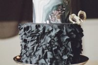 23 a moody glam wedding cake with marble layers and a black ruffle layer plus silver leaf touches