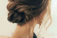 24 an elegant and effortless twisted low bun with a bump and some locks plus messy details