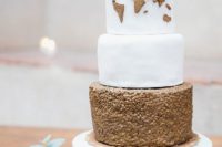 26 a travel-inspired wedding cake with a copper edible map and a copper sequin layer