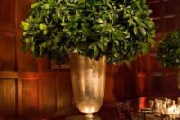 27 a tall leafy centerpiece in a large gold vase is all you need for modern rustic elegant at the table