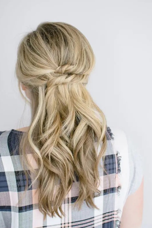 a beautiful half updo with a bump on top, a stacked twist and some waves down is a chic and lovely idea