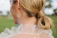 a casual low knot updo with a messy top is a cool idea for a modern or minimalist look