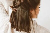 a creative dark brown half up wedding hairstyle with large braids on top and hair down is a cool idea for a boho bride or bridesmaid