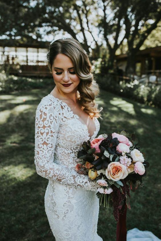 a dark burgundy lip and smokeys are a great idea for a statement bridal look in any season