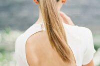 a gorgeous sleek twisted ponytail is the best option for a minimalist wedding