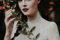 a haunted bridal look with an aubergine lip and no other accents is a bit spooky yet very chic