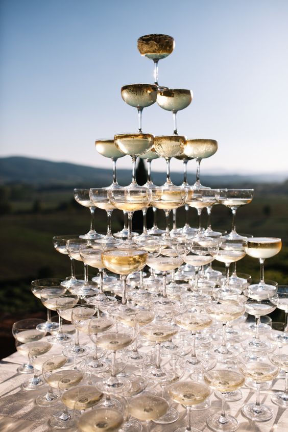 a large champagne tower is sure to impress every guest, and sun beams will play on the glass edges