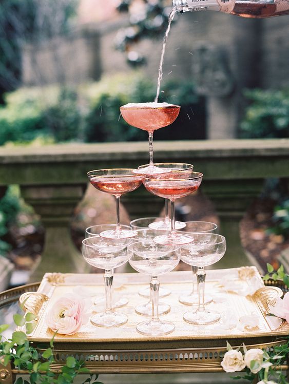 a mini rose champagne tower is great not only for small weddings but also for engagement parties