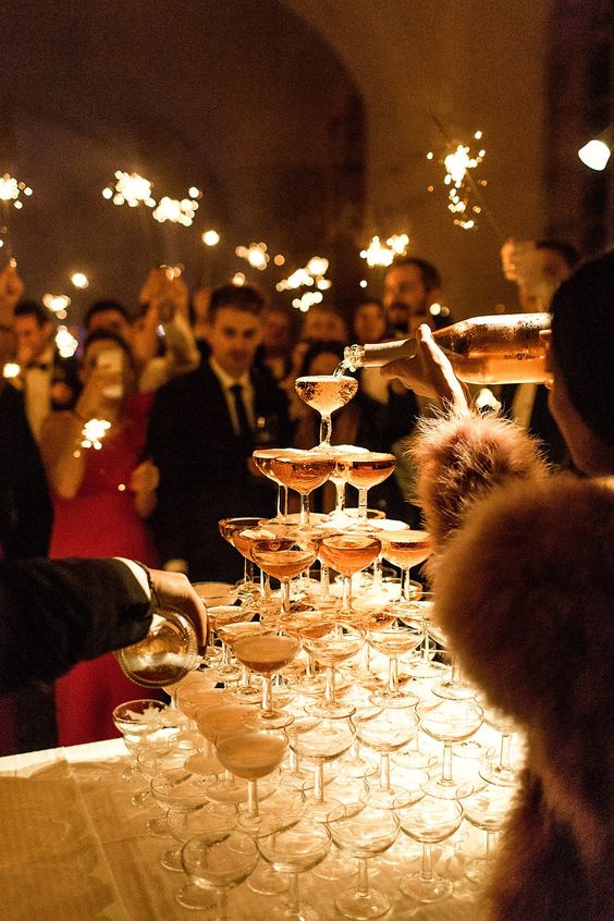 a perfectly built champagne tower is amazing for New Year's Eve weddings, it's classics