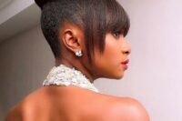 a sleek and sculptural updo with bangs, if you want a sleek finish, add hair gel to the hairstyle