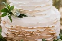 an ombre white to taupe ruffle wedding cake decorated with eucalyptus is a pretty solution for a spring or summer wedding