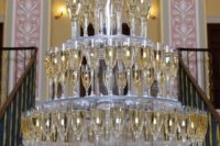 if you need a giant champagne tower but can’t build it, look for a proper stand or stands for the glasses