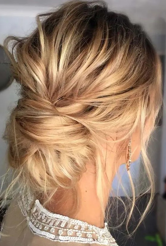 making such a messy low bun will take just a minute, leave some locks down to achieve an effortlessly chic look