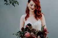 red hair and a very dark burgundy lip make the romantic bridal look balanced and more rock-like