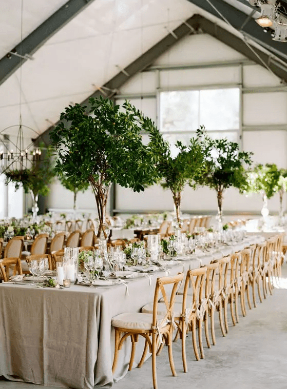 such tall foliage centerpieces remind of real trees and bring an organic feel to the space making it outdoorsy]