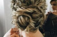 tie up your curly hair into a large twisted low bun, it will look very textural and messy, which is trendy