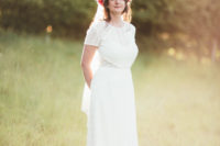 02 The bride was wearing a boho lace sheath wedding dress with short sleeves and illusion detailing