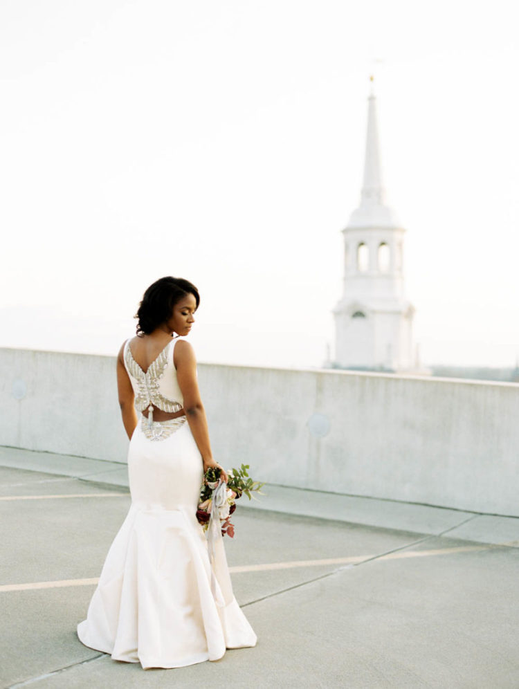 The bride was wearing a breathtaking plain fitting wedding dress with a gorgeous back