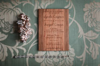 The wedding stationery was wooden and wood burnt to highlight the rustic feel