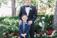 03 The groom was wearign a anvy tuxedo with black lapels and a white flower boutonniere