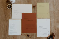 03 The wedding invitation suite is done in a muted color palette