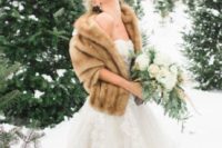 03 a chic beige faux fur stole contrasts the neutral wedding gown and makes the bride look chic and sophisticated