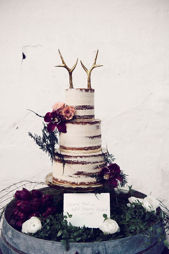 a couple of fake gilded antlers are great for a boho or woodland winter wedding cake and look unusual