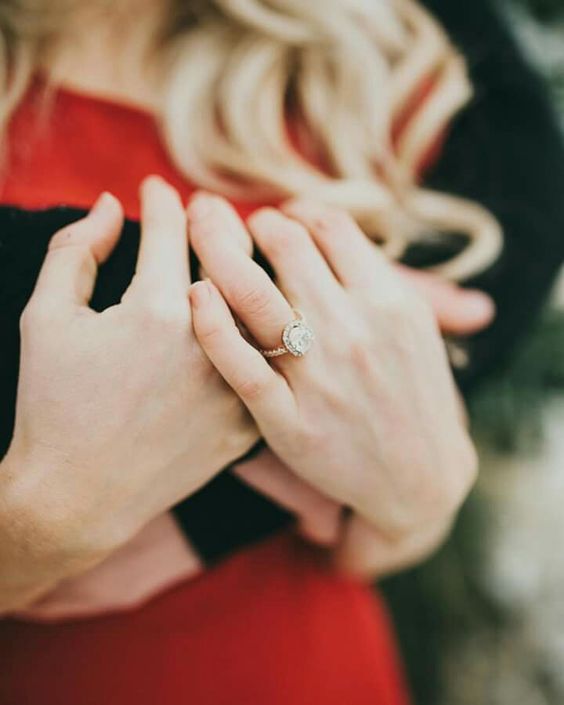 hug each other and show off your ring to create a feeling of love in the photo