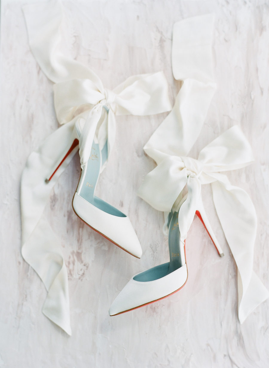 Here are chic white shoes with oversized bows that the bride wore