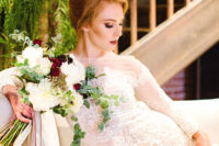 04 The bride was wearing a refined lace mermaid wedding gown with an illusion neckline, long sleeves, a burgundy lip
