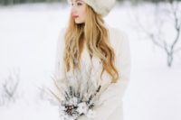 04 a neutral knit cardigan and matching mittens plus a faux fur hat for a snowy winter bride