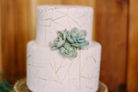 04 a white wedding cake with a crackle effect and succulents is a chic idea for a modern or desert wedding