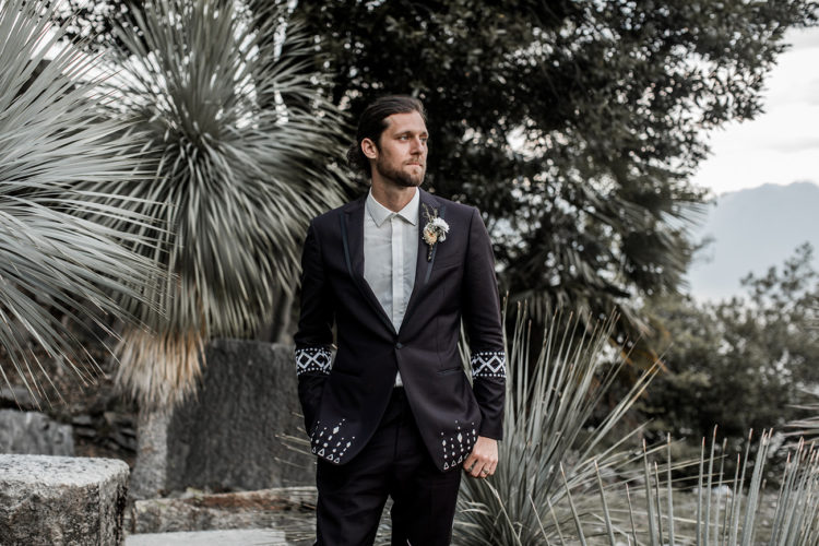 The groom designed his own deep purple tuxedo with embroidery for the wedding