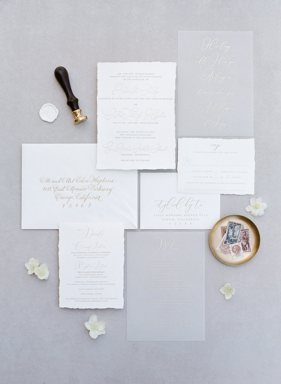 The wedding stationery suite was an elegant one, with acrylic and white parts and a raw hem