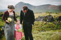 06 a bridal outfit with a grey strapless dress and a burgundy cardigan to stay warm at an outdoor ceremony