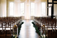 07 The wedding ceremony space was done with a fabric backdrop, lanterns, florals and greenery