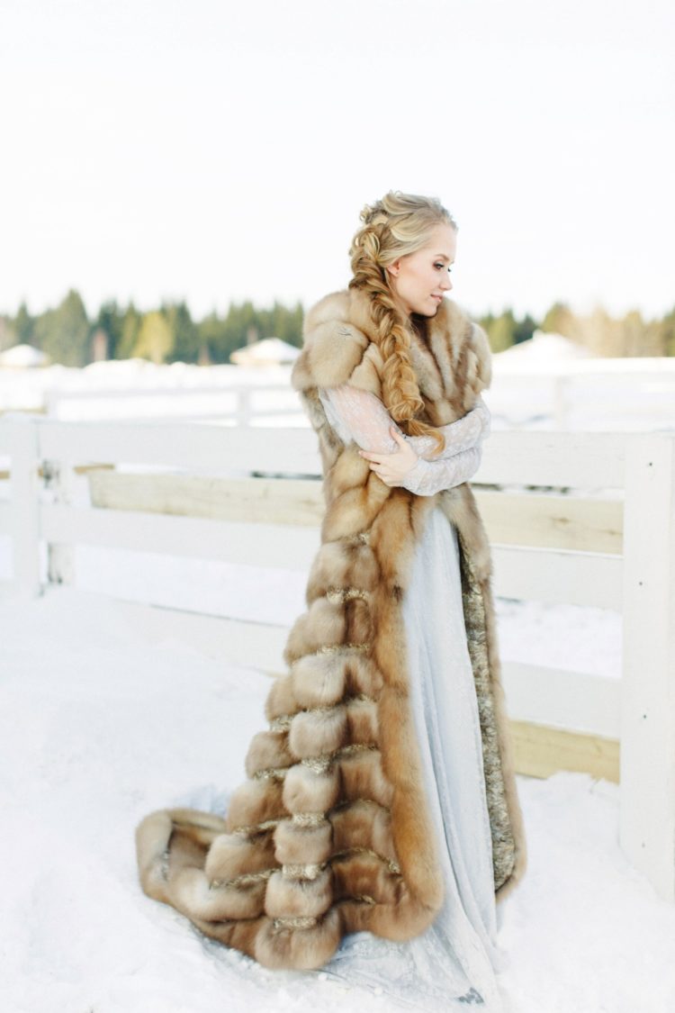 a gorgeous long faux fur sleeveless coat is a stunning accessory for a snowy winter wedding to feel a real ice queen