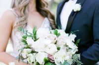 08 The wedding bouquet was super elegant, with white and dusty pink roses and foliage