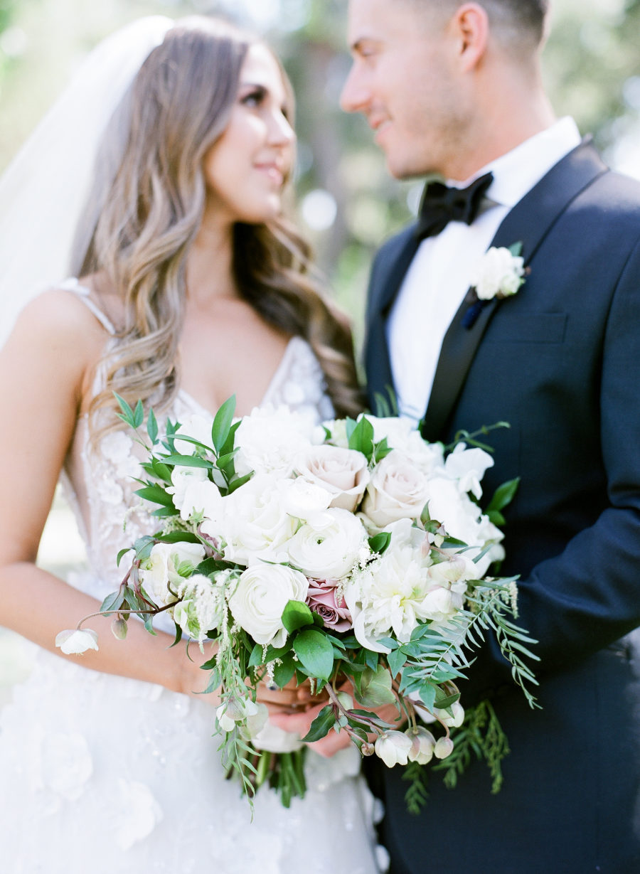 The wedding bouquet was super elegant, with white and dusty pink roses and foliage