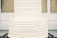 08 a textural white wedding cake with white blooms on top is a great idea to rock classic whites but spruce them up with a texture