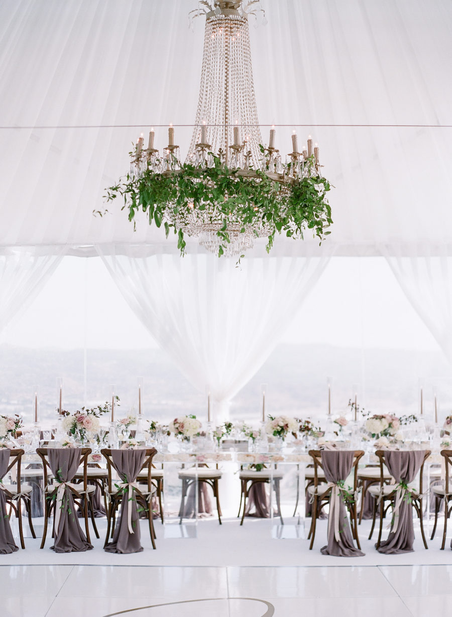 The wedding venue was super elegant and refined, done with lush greenery and blooms for a garden feel