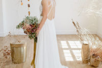 10 The bride switched for a minimalist wedding gown with a strappy back and a halter neckline