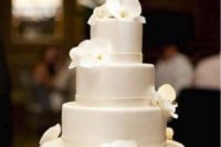 10 a plain white wedding cake with white orchids is pure and timeless elegance, which never goes out of style
