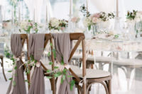 11 The chairs were decorated with taupe hangers, foliage and blush ribbons for a sophisticated feel