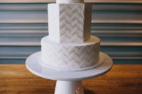 11 a modern geometric white fondant wedding cake with chevron detailing is a chic idea to rock