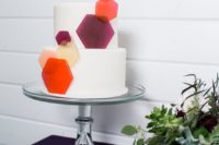 12 a pure white wedding cake decorated with colorful hexagons is a simple and timeless idea for a modern wedding