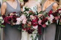 13 plain sheath bridesmaid dresses with deep neckline and thick straps and cascading pink and burgundy bouquets