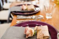 14 a burgundy charger, a grey napkin and a blush rose is a chic place setting idea with a decadent feel