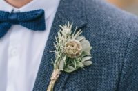 a boutonniere of rosemary, seeded herbs, greenery and a twine wrap for a textural and rustic feel